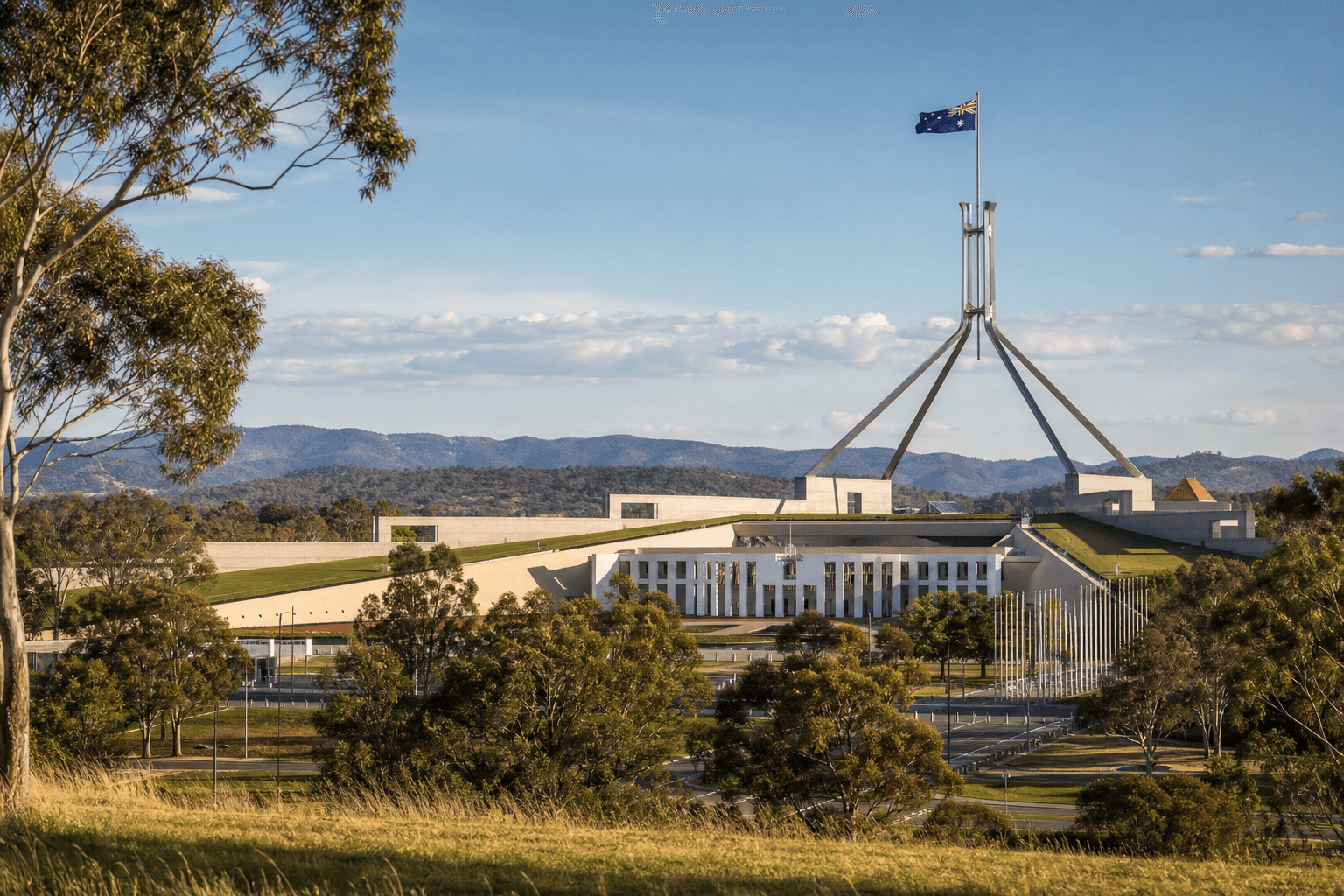 Australian Parliament House in Canberra beneath a clear sky